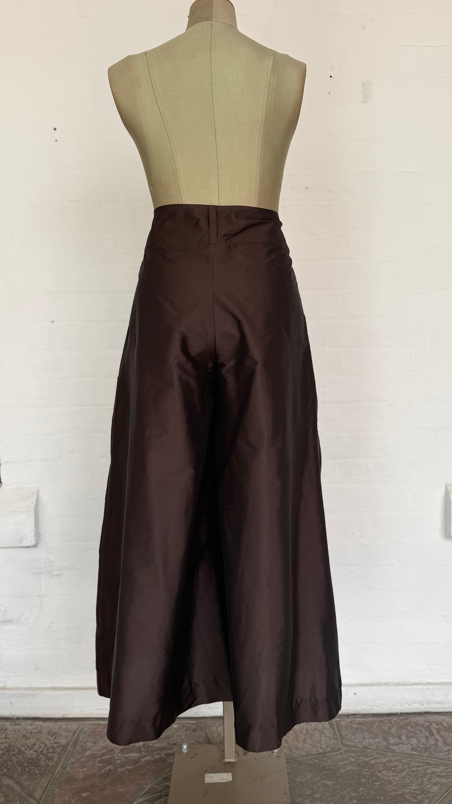 High-Waisted Brown Pleated Wide-Leg Culottes with Buttons.