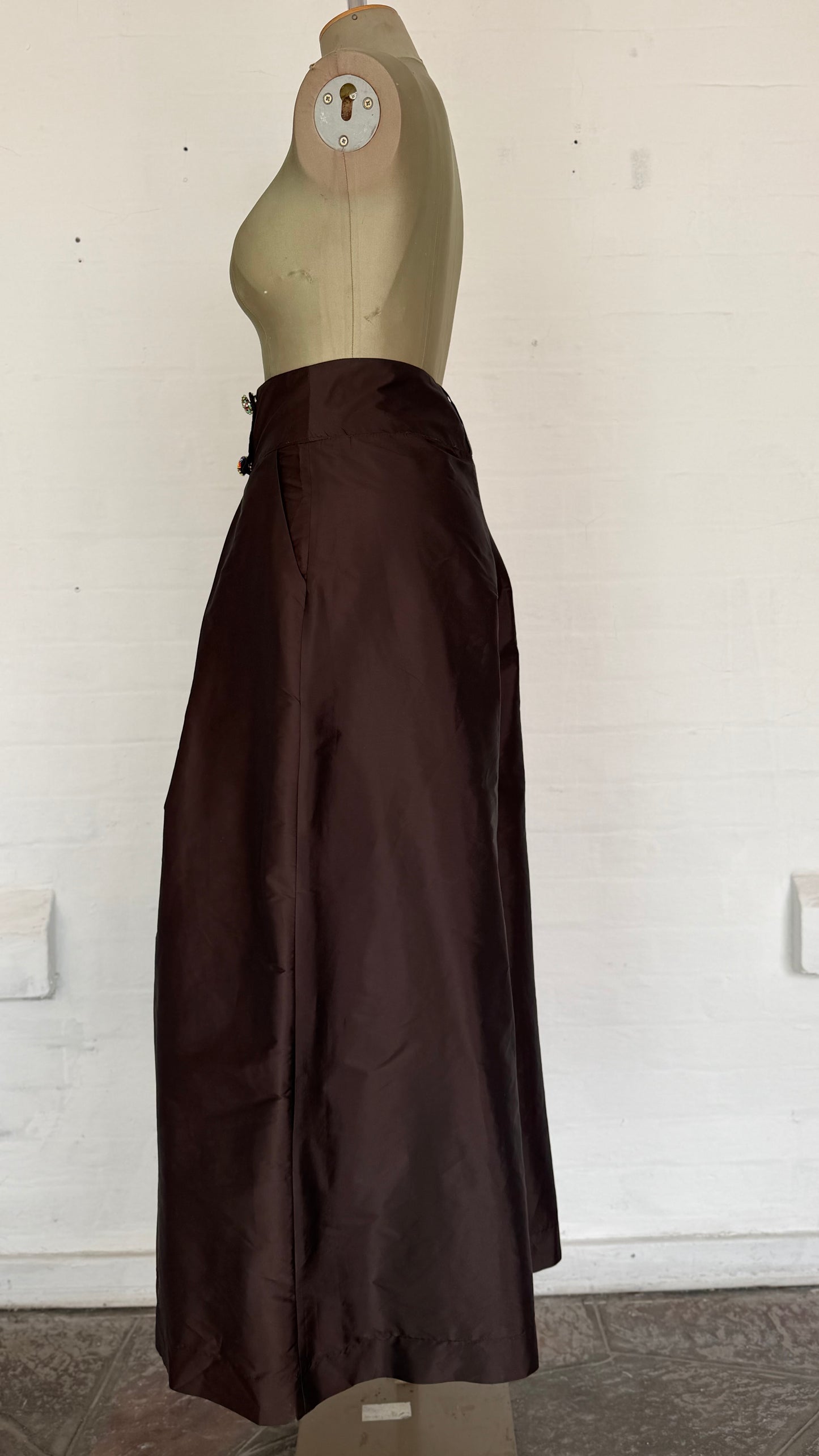High-Waisted Brown Pleated Wide-Leg Culottes with Buttons.