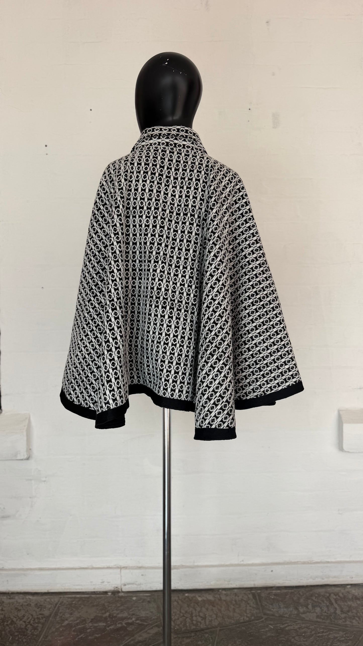 Black & White Geometric Pattern
Button-Front Cape Jacket